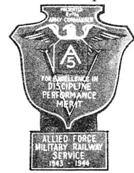 Photo Caption: 5th Army Plaque and Clasp presented to MRS by Lt. Gen. Mark W. Clark [Inscription reads:"Presented by the Army Commander / For Excellence in Discipline Performance Merit / Allied Force MilitaryRailway Service 1943 - 1944"]